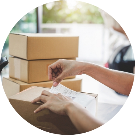 placing a sticker label on a package for shipping